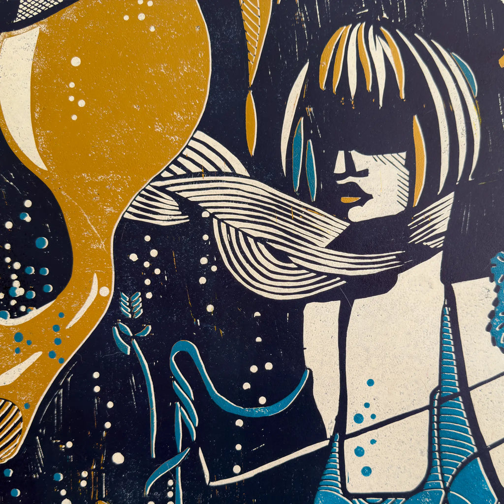 Detail from the linocut Underwater Love. It depicts a figurative female figure in gold, blue, and white, wearing a blindfold and a scarf, and surrounded by aquatic plants.