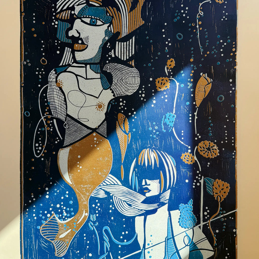 Detail from the linocut Underwater Love. It shows the reflection of sunlight on the artwork and how the colors begin to glow as a result.
