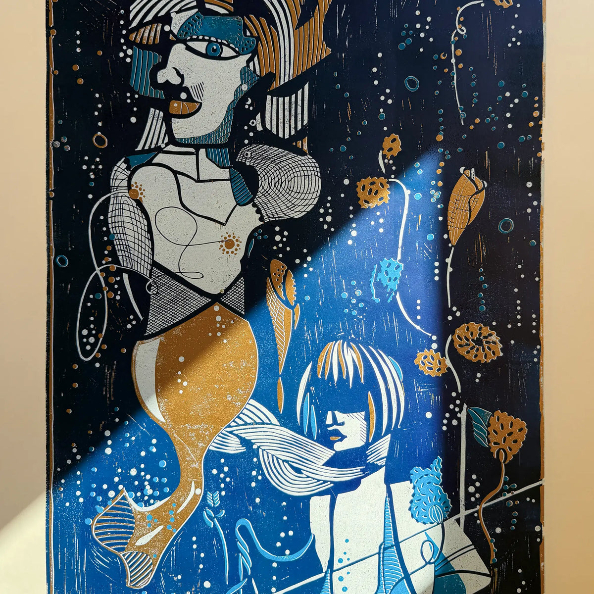 Detail from the linocut Underwater Love. It shows the reflection of sunlight on the artwork and how the colors begin to glow as a result.