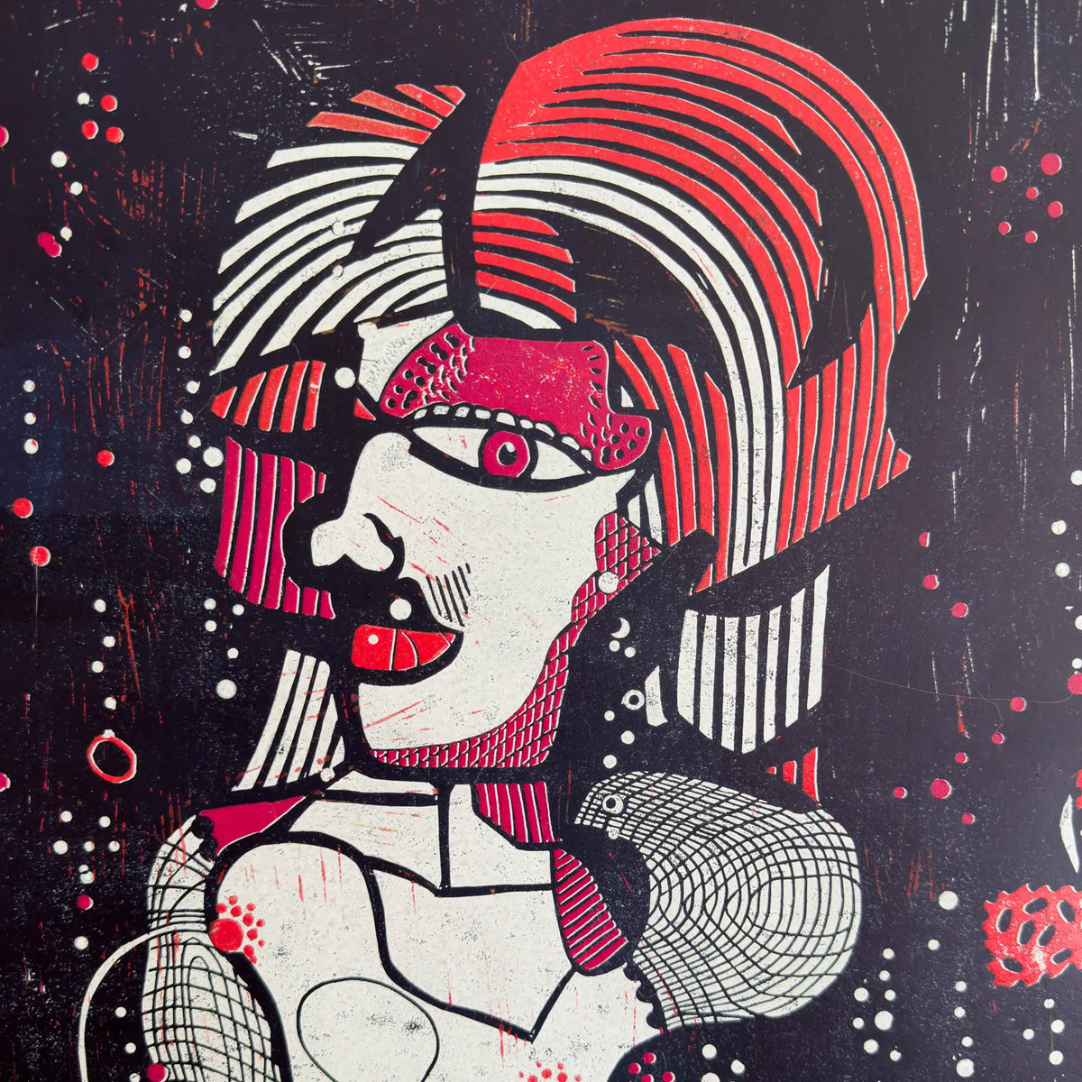 Detail from the linocut Underwater Love. It depicts a portrait of a male figure in red and white.